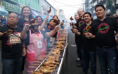 <p><strong>CHICKEN INASAL FESTIVAL. </strong>Russian Ambassador Igor Khovaev (3<sup>rd</sup> from right) and First Secretary Dmitry Larionov (4<sup>th</sup> from right) with Bacolod City Lone District Representative Greg Gasataya (right), Mayor Evelio Leonardia (2<sup>nd</sup> from right), City Administrator John Orola (left), and Councilors Em Ang (2<sup>nd</sup> from left) and Cindy Rojas (5<sup>th</sup> from left) during the 1st Bacolod Chicken Inasal Festival on Saturday. <em>(Photo by Nanette L. Guadalquiver)</em></p>